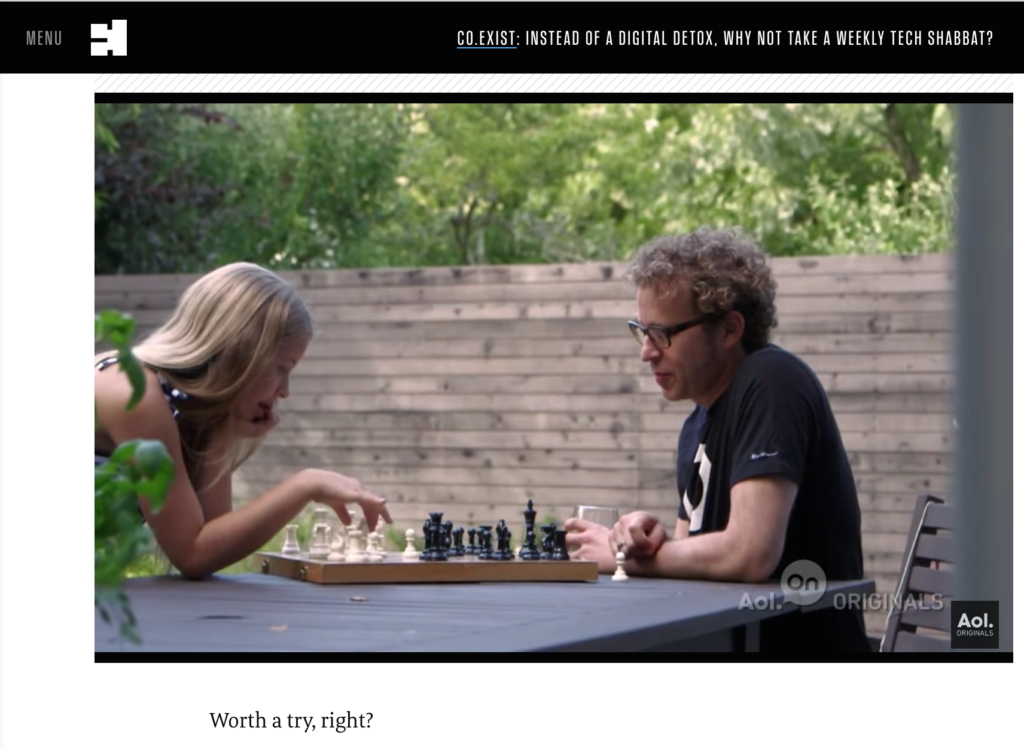 father and teen daughter playing chess at outside table